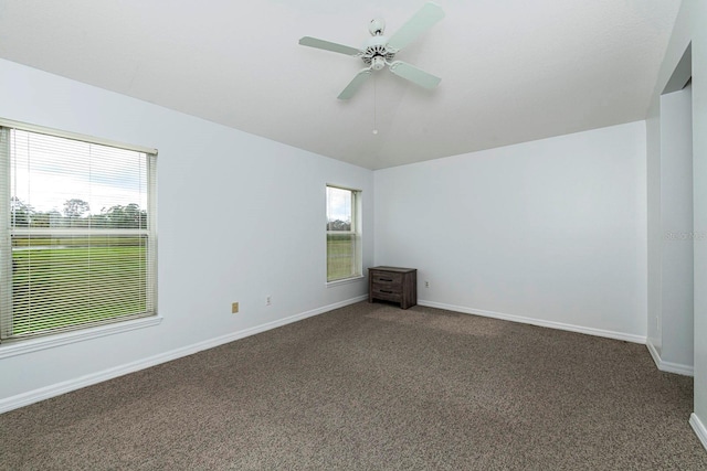 empty room featuring carpet flooring and ceiling fan