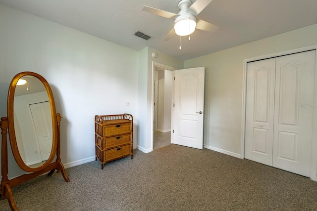 bedroom featuring ceiling fan, carpet floors, and a closet