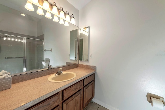 bathroom with tile patterned flooring, vanity, and a shower with shower door