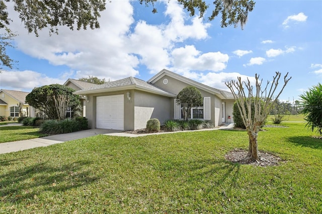 view of front of home with a front lawn, concrete driveway, an attached garage, and stucco siding