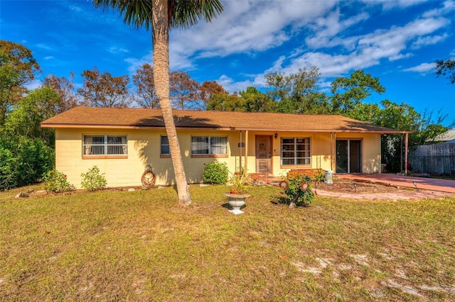 single story home featuring a front yard