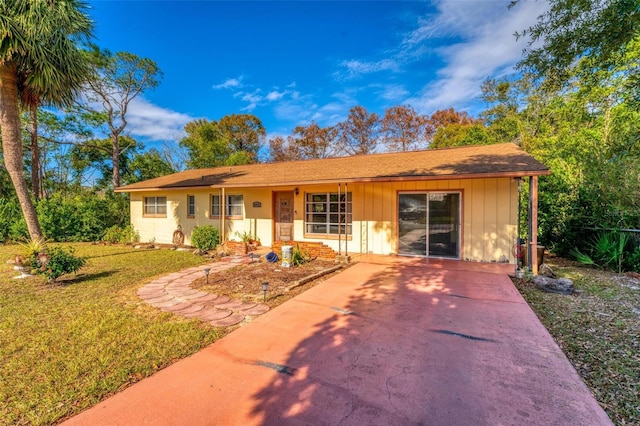 ranch-style house with a front lawn