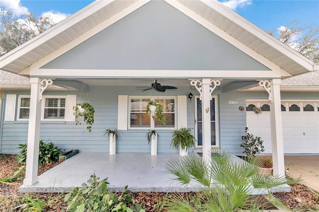 exterior space featuring ceiling fan and a garage