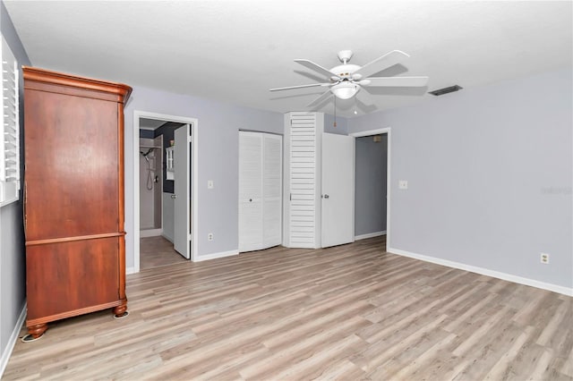 unfurnished bedroom with ceiling fan and light hardwood / wood-style floors