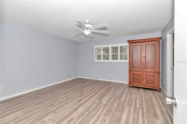 unfurnished bedroom featuring ceiling fan and light hardwood / wood-style flooring