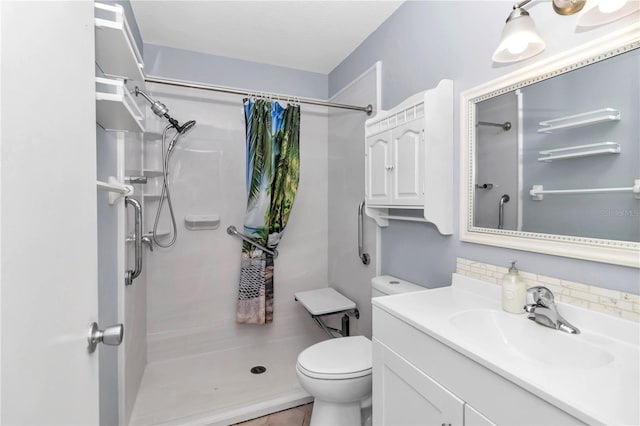 bathroom with toilet, vanity, a shower with curtain, and tile patterned floors