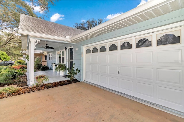 view of front of home featuring ceiling fan and a garage