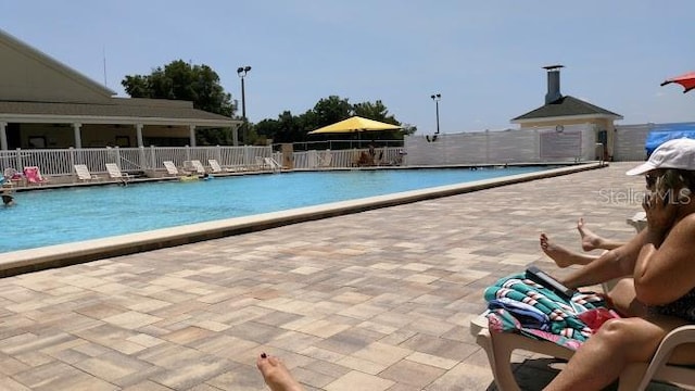 view of swimming pool featuring a patio area