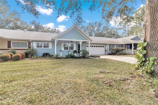 ranch-style home featuring a garage, a front yard, and covered porch