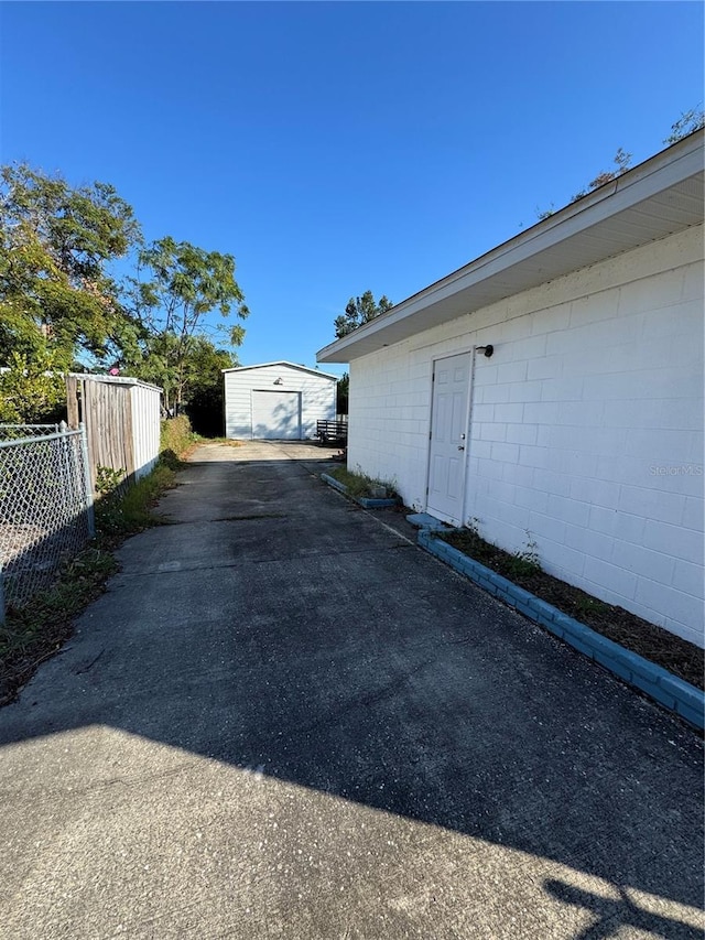 exterior space featuring an outbuilding and a garage