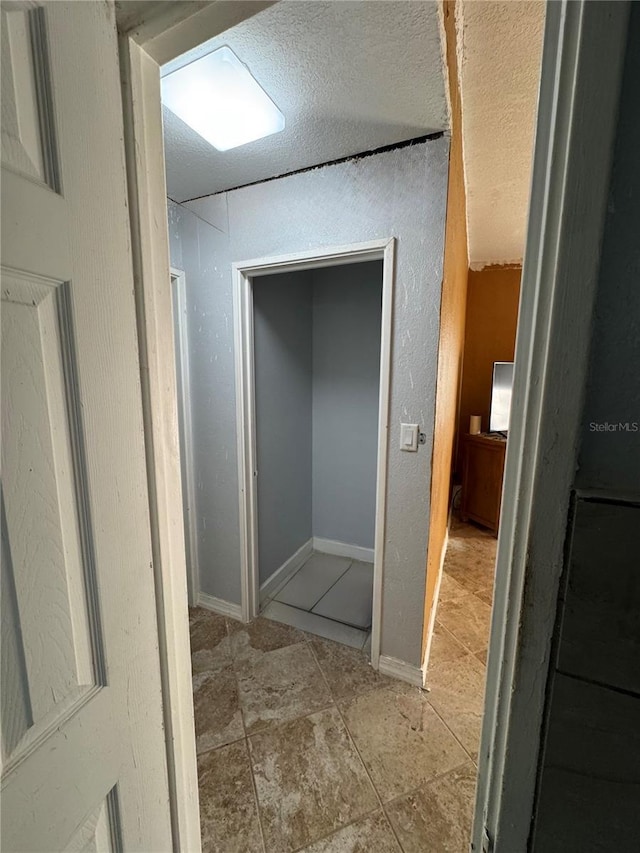 bathroom featuring a textured ceiling