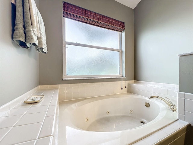 bathroom with tiled tub