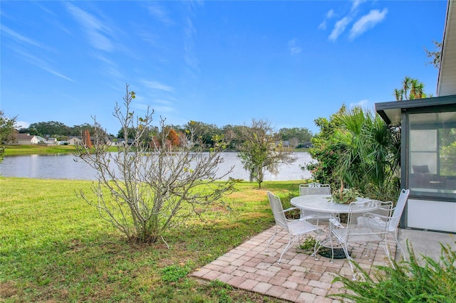 view of yard with a patio area and a water view