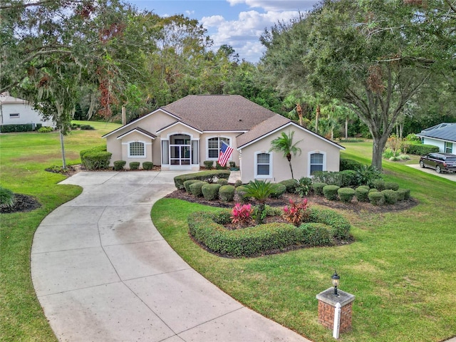 ranch-style house with a front lawn