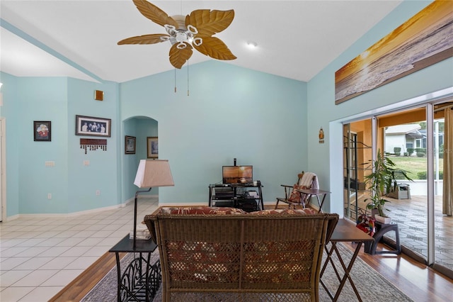 office with ceiling fan, vaulted ceiling, and light wood-type flooring