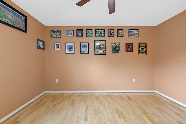 empty room featuring ceiling fan and light hardwood / wood-style floors