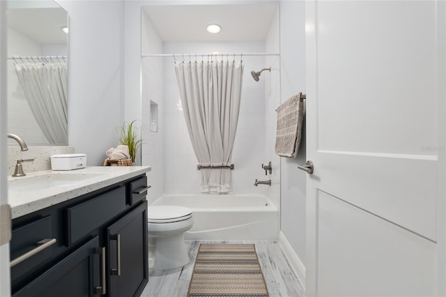 full bathroom featuring vanity, toilet, and shower / bath combo with shower curtain