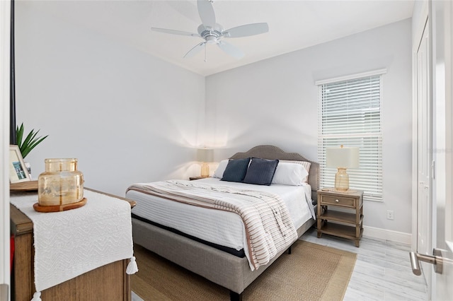 bedroom featuring light hardwood / wood-style flooring and ceiling fan