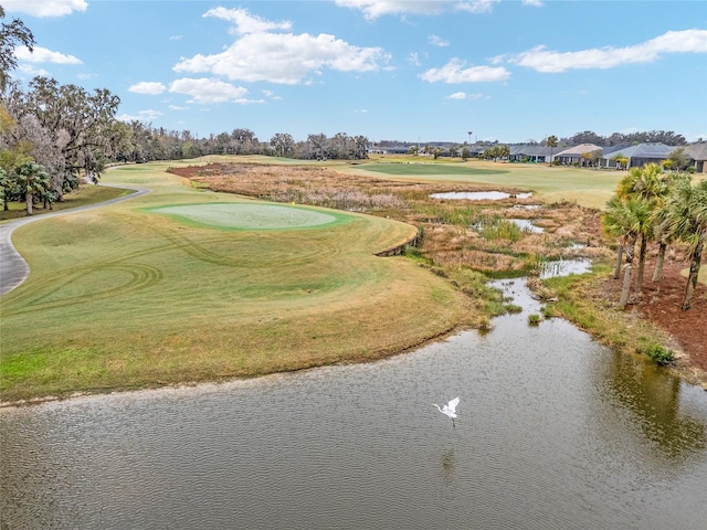 surrounding community featuring golf course view and a water view