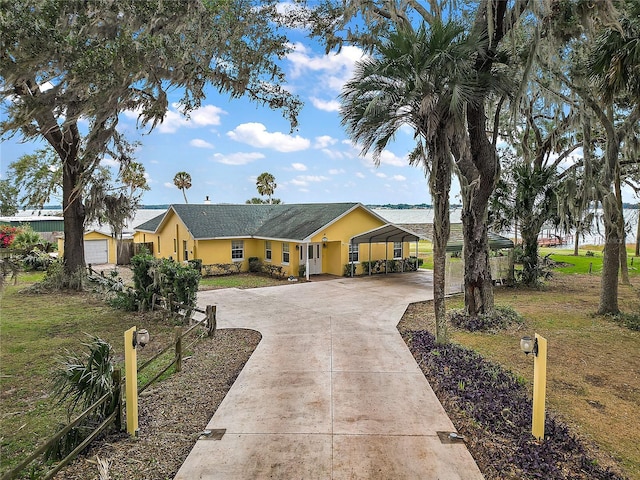 single story home with a front lawn and a carport