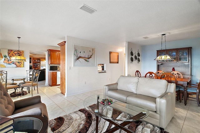 tiled living room with a textured ceiling