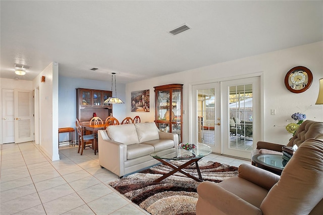 tiled living room with french doors