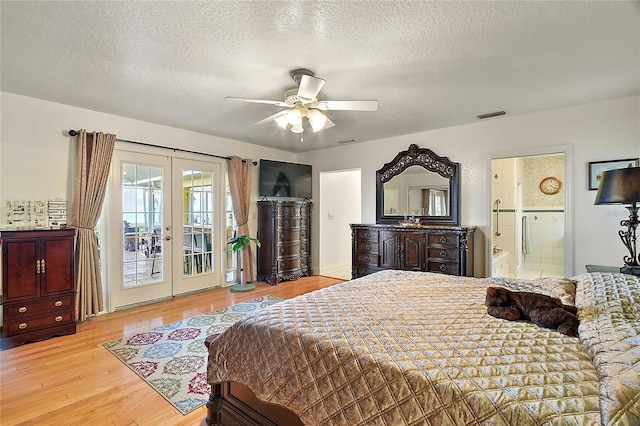 bedroom with ceiling fan, french doors, a textured ceiling, access to outside, and light wood-type flooring