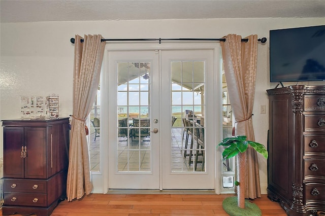 doorway featuring light hardwood / wood-style floors and french doors