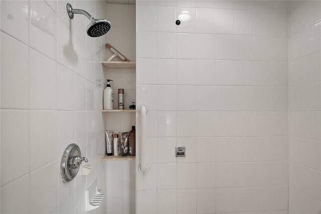 bathroom with a tile shower