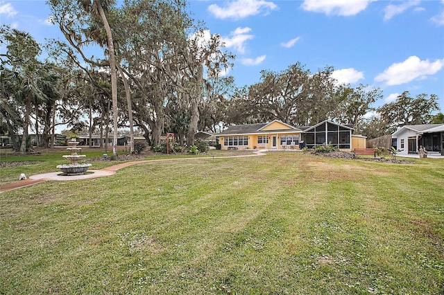 view of yard with a sunroom