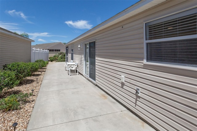 view of property exterior featuring a patio area