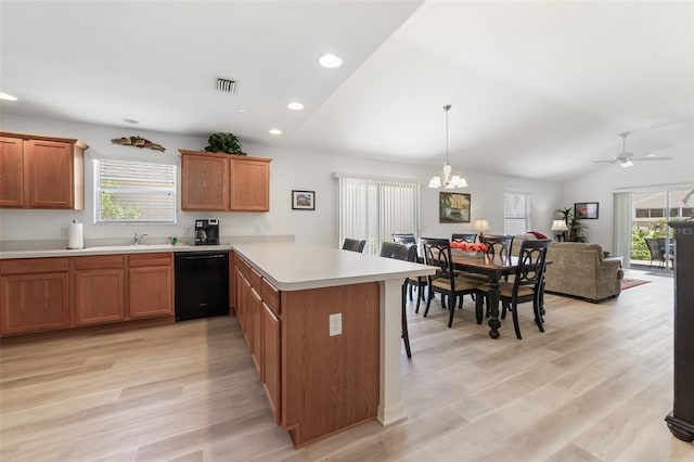 kitchen featuring dishwasher, kitchen peninsula, decorative light fixtures, lofted ceiling, and ceiling fan with notable chandelier