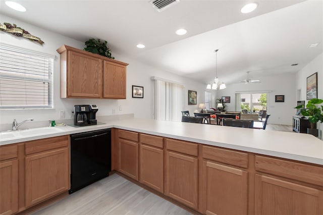 kitchen featuring sink, black dishwasher, kitchen peninsula, lofted ceiling, and ceiling fan with notable chandelier