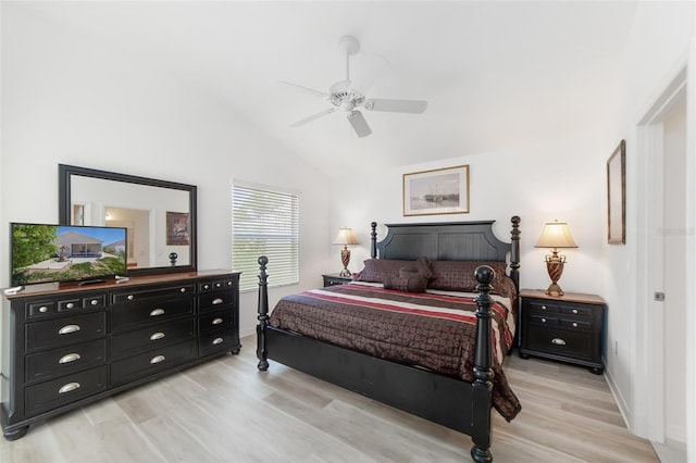 bedroom with ceiling fan, light hardwood / wood-style flooring, and lofted ceiling