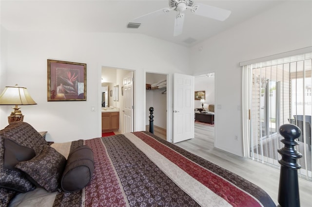 bedroom featuring access to outside, vaulted ceiling, ceiling fan, light wood-type flooring, and a closet