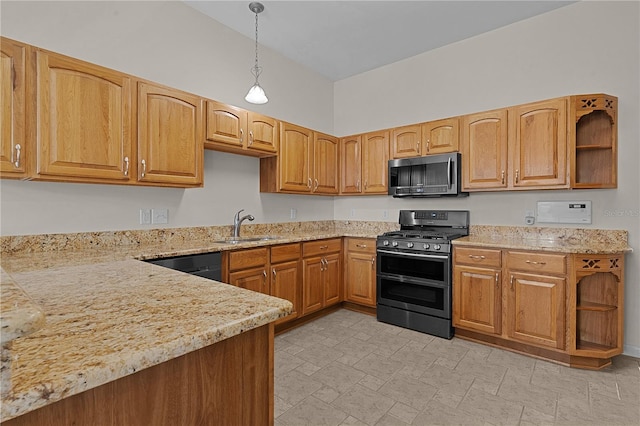 kitchen featuring hanging light fixtures, sink, and stainless steel appliances