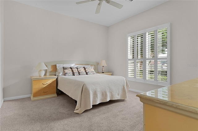 carpeted bedroom with multiple windows and ceiling fan