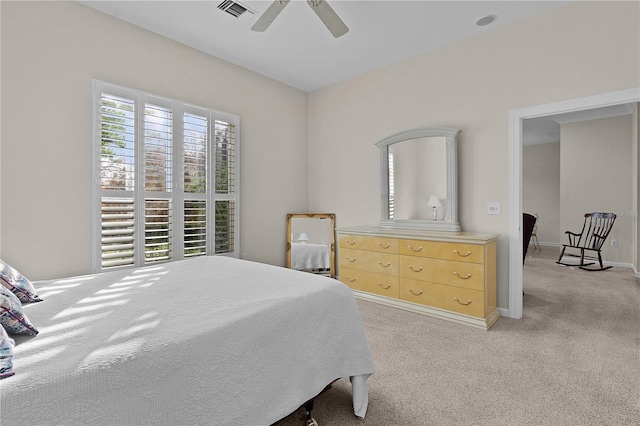 bedroom with light colored carpet and ceiling fan