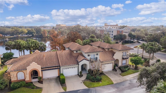 birds eye view of property with a water view