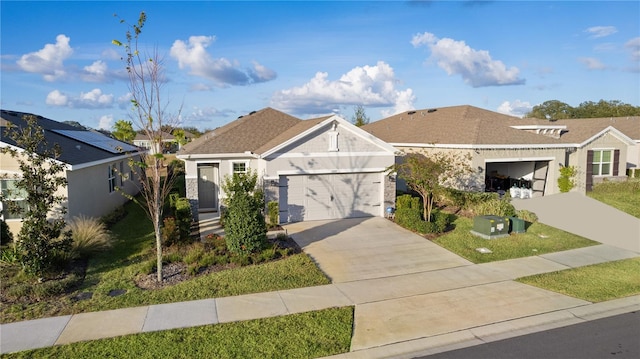 view of front of house featuring a front yard and a garage