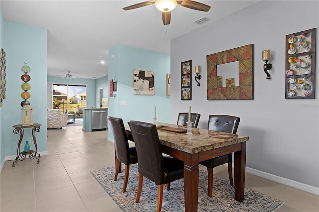 dining area with ceiling fan and light tile patterned floors