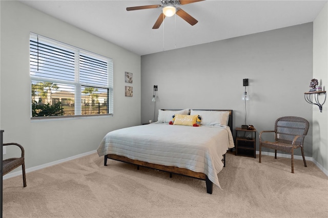 bedroom featuring ceiling fan and light carpet