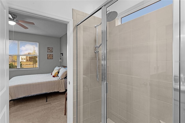 bathroom featuring walk in shower and ceiling fan