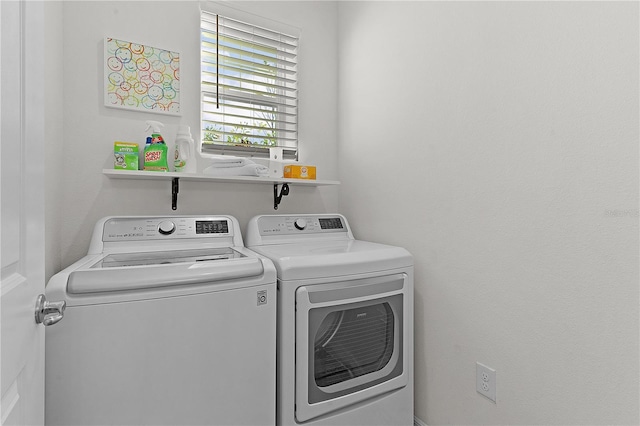 laundry area with independent washer and dryer