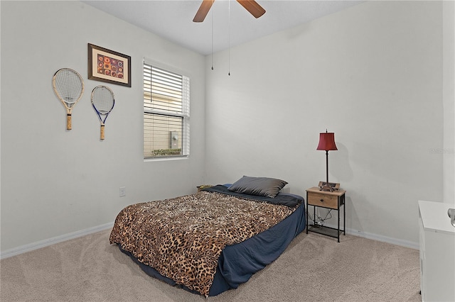 bedroom with ceiling fan and light colored carpet