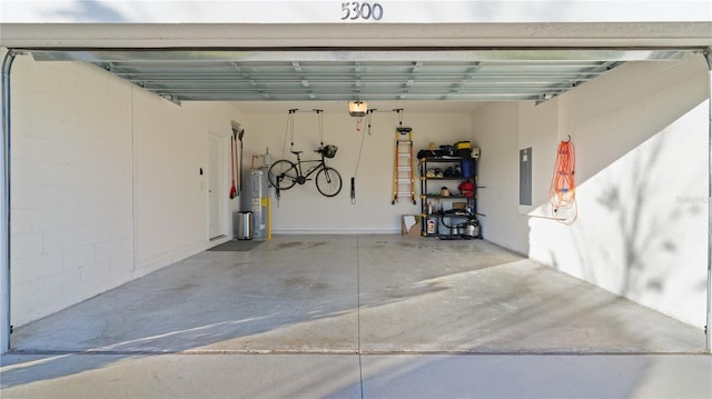 garage featuring a garage door opener, electric panel, and water heater