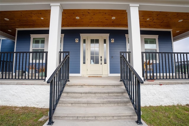 doorway to property with a porch