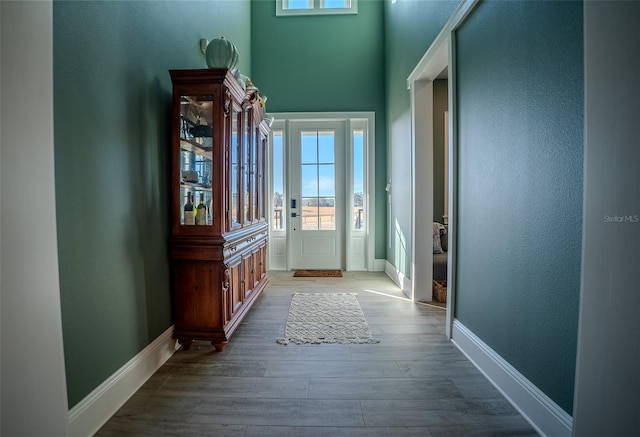 doorway with hardwood / wood-style floors