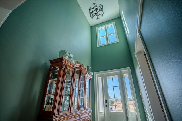 entryway with a notable chandelier