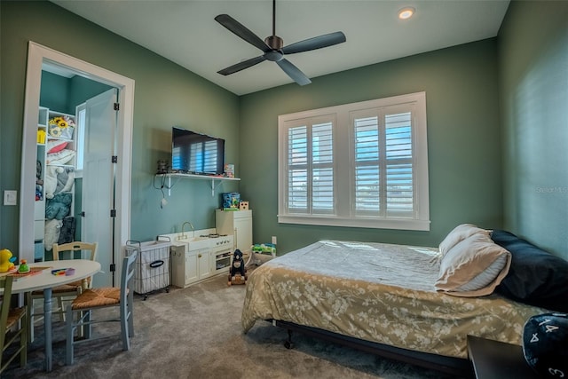 carpeted bedroom with ceiling fan